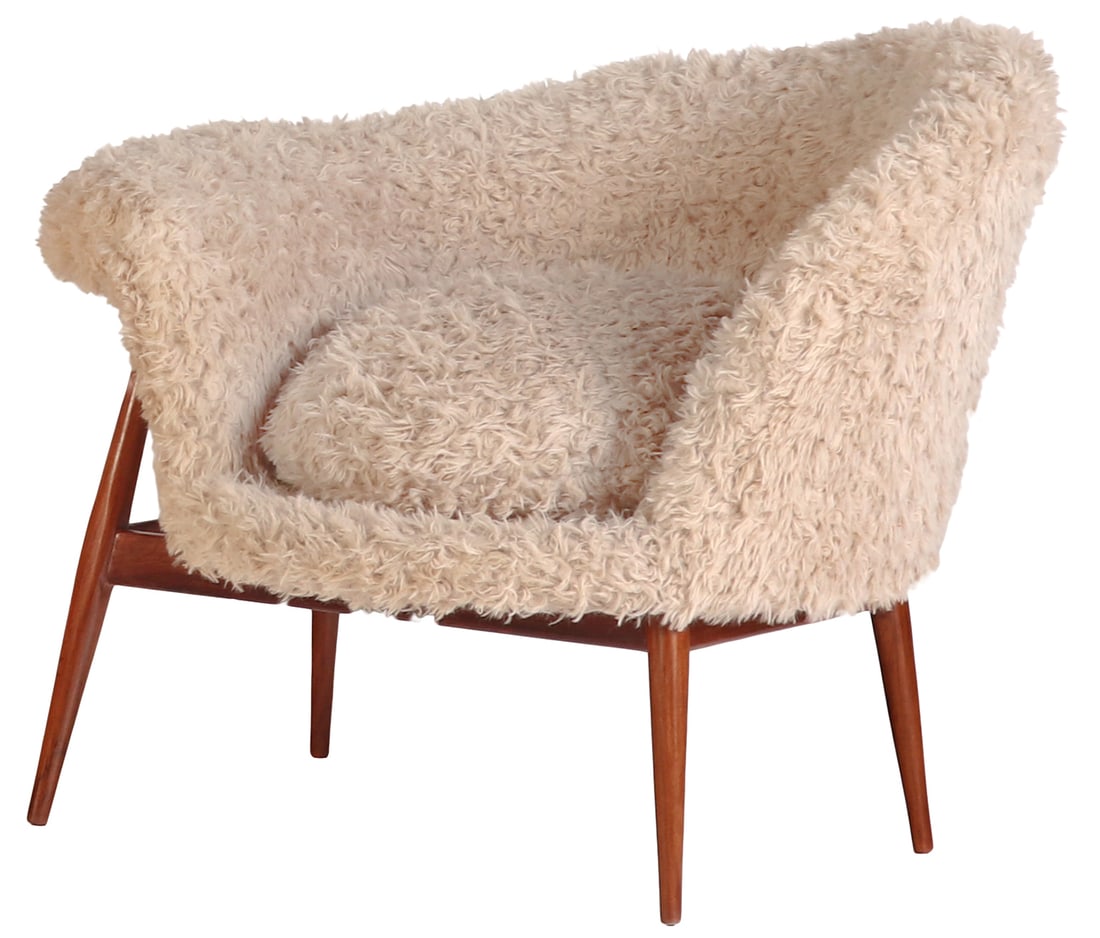 A FRIED EGG STYLED LOUNGE CHAIR AFTER THE DESIGN BY HANS OLSEN, UPHOLSTERED IN A SHAGGY FAUX FUR: A Fried Egg styled lounge chair after the design by Hans Olsen, upholstered in a shaggy faux fur upholstery. Ht: 30" Wd: 39" Dpth: 32" Seat: 18"