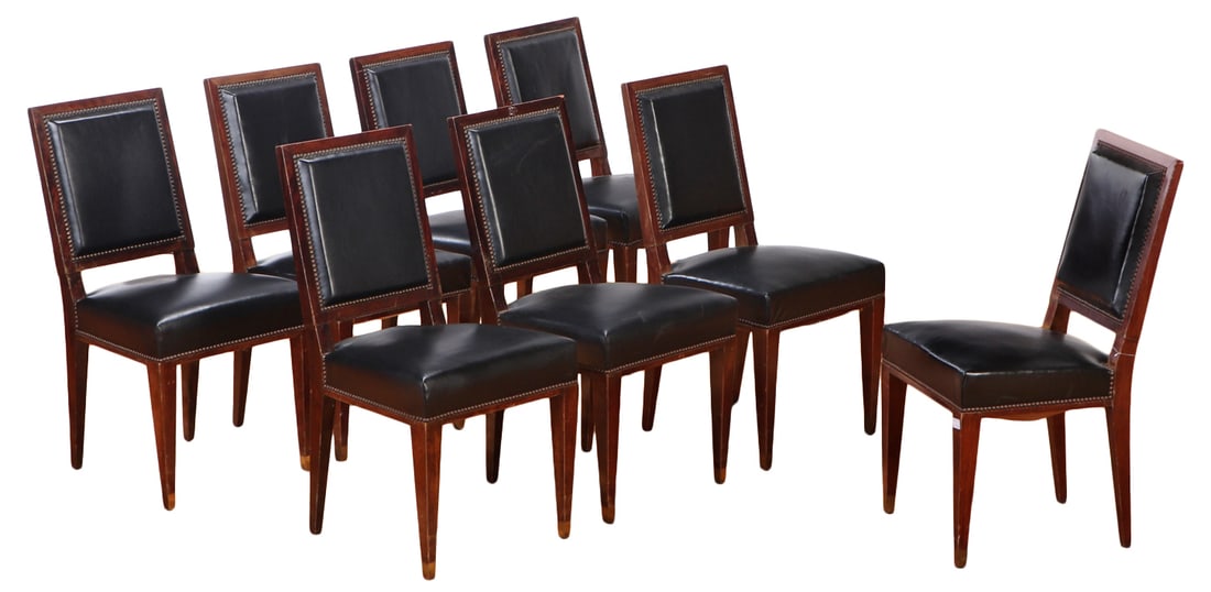 EIGHT FRENCH MAHOGANY AND LEATHER DINING CHAIRS C 1940 IN THE MANNER OF JEAN-MICHEL FRANK. A NINTH: Eight French mahogany and leather dining chairs C 1940 in the manner of Jean-Michel Frank. A ninth chair may be available. Ht: 35.25" Wd: 18.5" Dpth: 19.5" Seat: 18.5"
