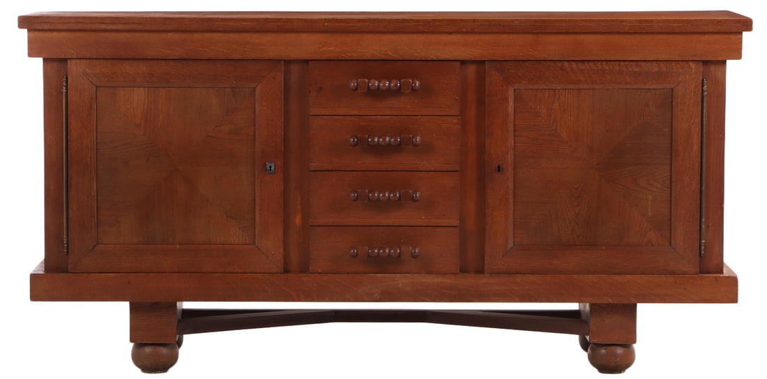 FRENCH OAK SIDEBOARD HAVING TWO DOORS FLANKING A BANK OF DRAWERS WITH INTERESTING HANDLES C 1940. (1 of 6)