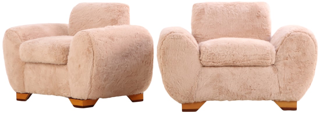 PAIR OVERSIZED ART DECO STYLE CLUB CHAIRS UPHOLSTERED IN FAUX FUR IN THE MANNER OF JEAN: Pair oversized Art Deco style club chairs upholstered in faux fur in the manner of Jean Royere. Ht: 32" Wd: 46" Dpth: 29" Seat: 20"