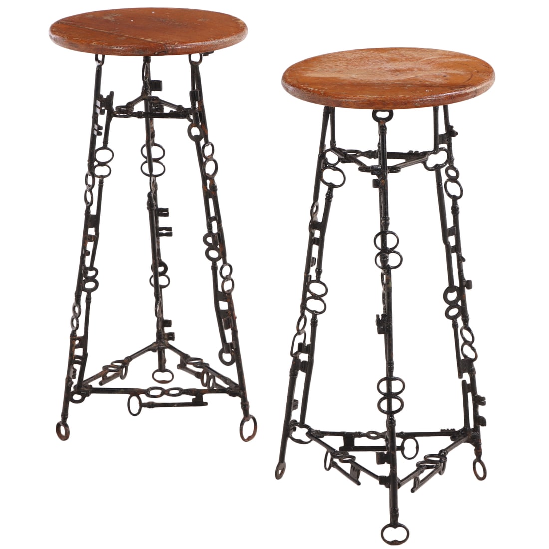 A PAIR OF IRON AND OAK TABLES OR STOOLS MADE FROM SKELETON KEYS AND BRANDED TO UNDERSIDE BY THE (1 of 6)