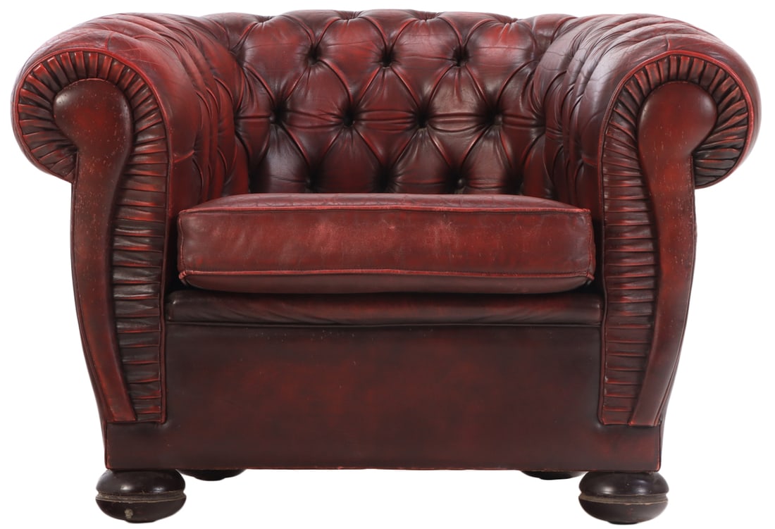 A STYLIZED RED LEATHER CHESTERFIELD CLUB CHAIR WITH BUTTON BACK UPHOLSTERY CIRCA 1950. (1 of 9)