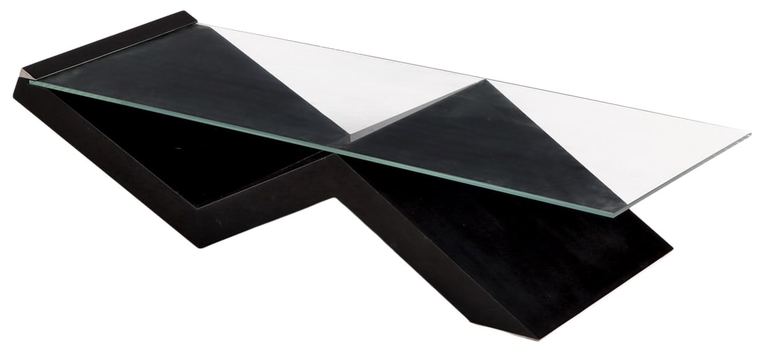 A SLEEK COFFEE TABLE HAVING A GEOMETRIC EBONIZED & LACQUERED WOOD BASE WITH A RECTANGULAR GLASS TOP. (1 of 5)