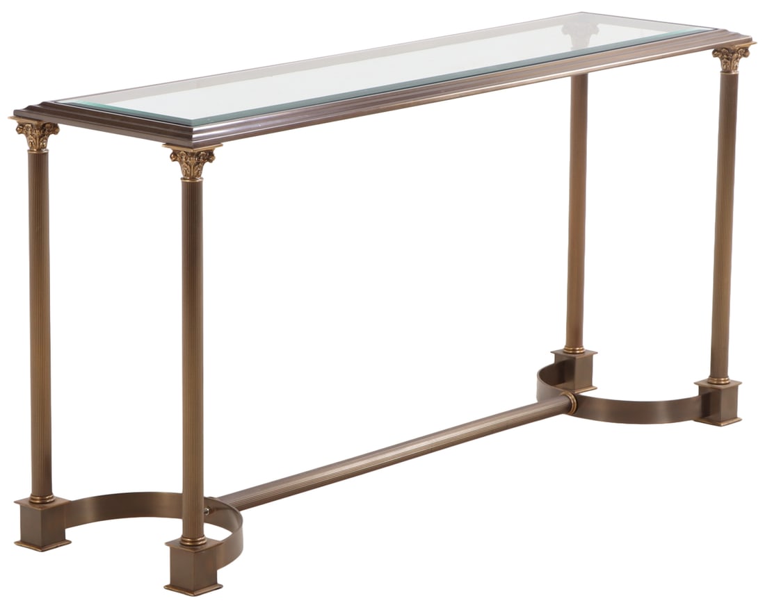 A BRASS AND IRON CONSOLE TABLE HAVING CORINTHIAN CAPITALS AND A BEVELED GLASS TOP C 1970. (1 of 6)