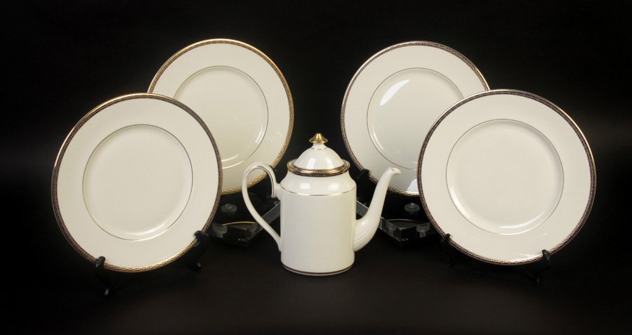 GROUP OF MINTON DINNERWARE: A grouping of Minton dinnerware in the St. James pattern circa 1960. Consisting of (12) dinner plates, (12) salad plates, (12) bread plates, (12) cups, (12) saucers, and (1) coffee pot.