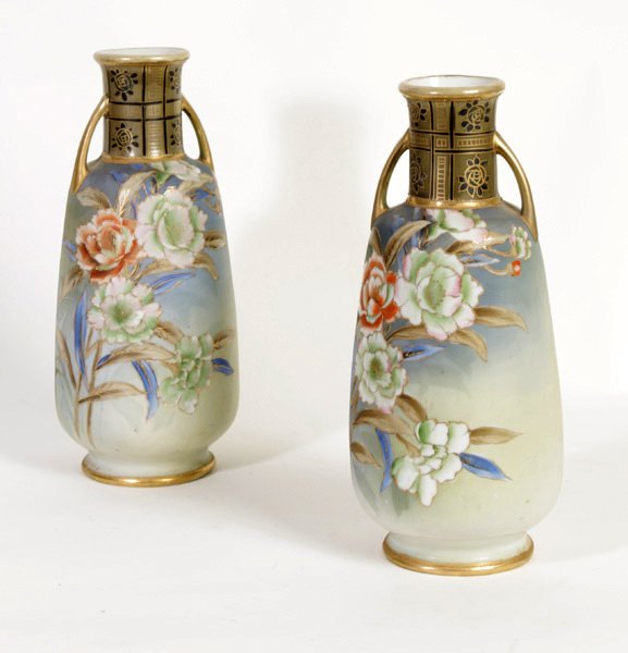 PR 2 HANDLED HAND PAINTED NIPPON PORCELAIN VASES: A pair of two handled hand painted Nippon porcelain vases having painted rose decoration circa 1940. Ht: 11" Width: 4" Depth: 4"
