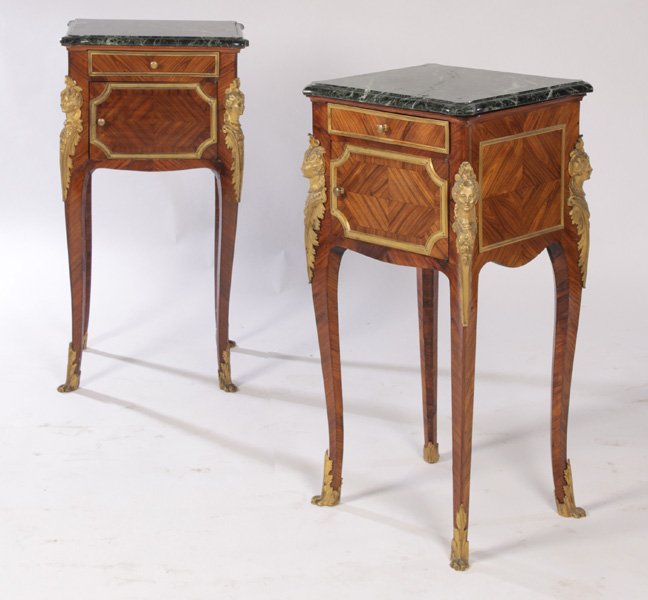2 FRENCH FIGURAL BRONZE MARBLE TOP STANDS C.1900: A good and rare pair of French figural bronze mounted marble top stands circa 1900. The shaped green marble tops resting on a case of one drawer and one door. All four corners having bronze mounts of 