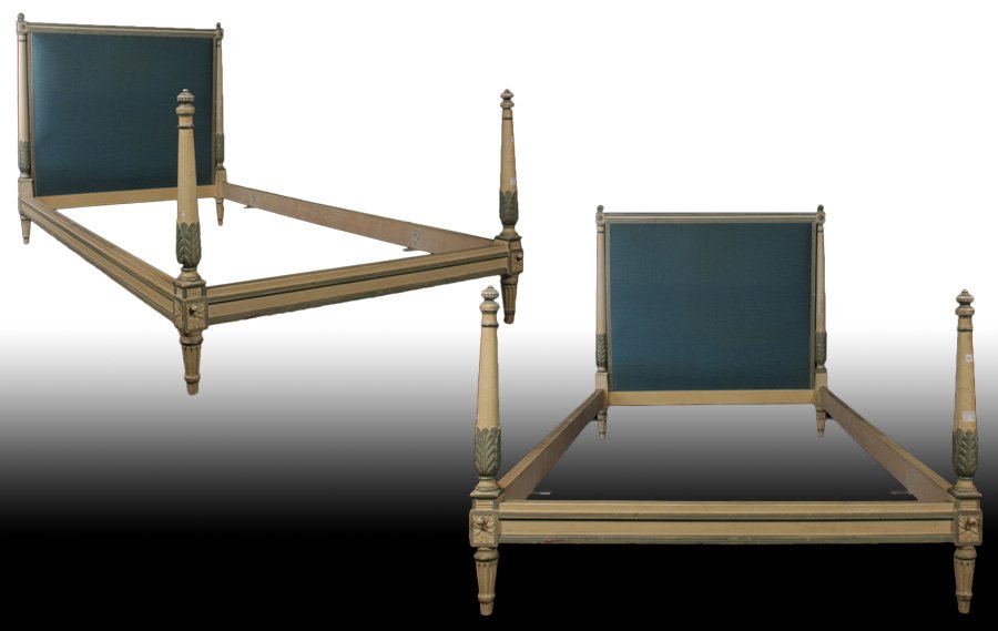 GOOD PAIR OF DIRECTOIRE STYLE BEDS CIRCA 1940: Good pair of directoire style carved and painted beds having upholstered head boards flanked by acanthus leaf carved turned columns circa 1940. Raised on fluted legs. Ht: 43.5" Width: 42"