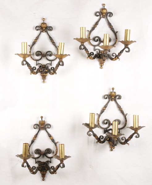 2 PAIRS OF MATCHING IRON WALL SCONCES C. 1950: Two pairs of matching iron wall sconces with gold accents, one pair being three-light and the other being two-light European made, circa 1950. Ht: 15.5" Width: 12.5-15" Depth: 7.75-9.75"