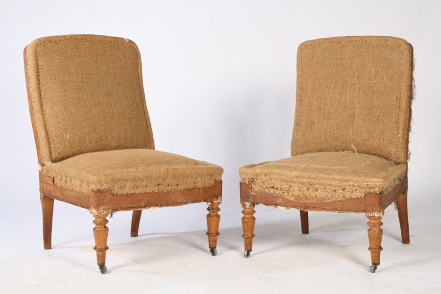 PAIR OF NAPOLEON III SLIPPER CHAIRS CIRCA 1900: A pair of Napoleon III slipper chairs supported on turned legs circa 1900. Ht: 32" Width: 21" Depth: 21"