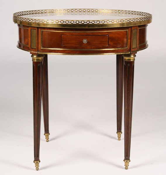 DIRECTOIRE STYLE GUERIDON WITH MARBLE TOP C.1900: A good Directoire style guéridon having brass gathered marble top over two drawers and two shades, circa 1900. Supported on bronze trimmed turned and fluted legs with sabots . Ht: 28" Dia: 26.5"