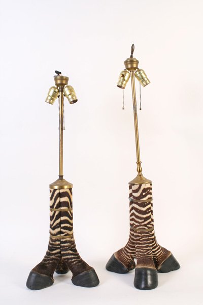 PAIR OF 20TH C. ZEBRA STYLE HOOF TABLE LAMPS: A twentieth Century pair of zebra style hoof table lamps, each having three legs per lamp. Ht: 32" Width: 11.5" Depth: 11.5"