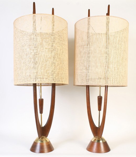 MATCHED PAIR OF MID CENTURY MODERN TABLE LAMPS: A matched pair of teakwood and brass mid century modern table lamps with period shades, circa 1960. Ht: 40" Width: 15" Depth: 15"