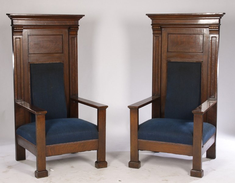 PAIR OVERSIZED OAK THRONE CHAIRS: A pair of oversized oak throne chairs circa 1900. Ht: 66" Width: 36" Depth: 31"