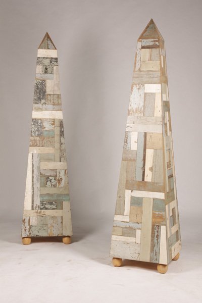 PAIR OF RECYCLED WOOD OBELISKS PATCHWORK DESIGN: Large and impressive pair of polychromed patchwork obelisks. Ht: 83" Width: 19" Depth: 19"