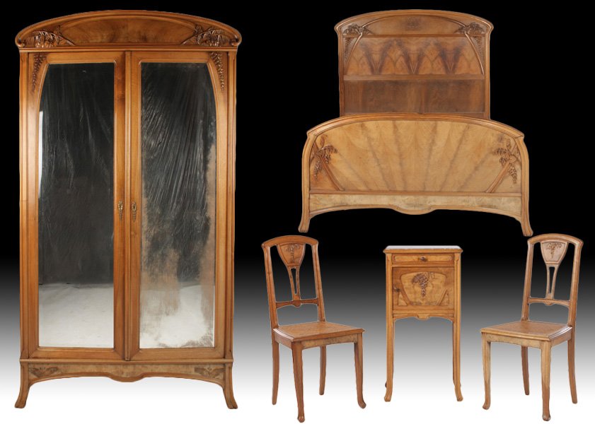 5 PC SET ART NOUVEAU FURNITURE BEDROOM C 1920: Five piece set of Art Nouveau furniture including an armoire, matching bed, side table and two chairs all with similar carved motifs circa 1920. Armoire with stylized leaf carving and two beveled mirr
