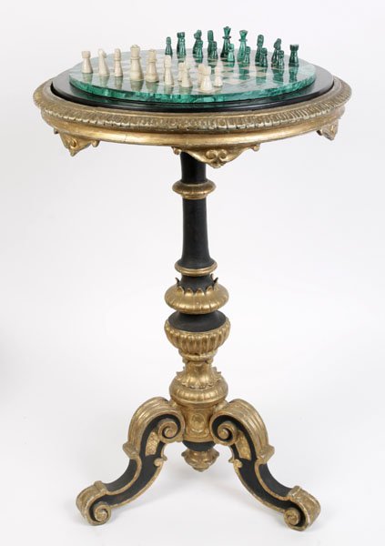 GILTWOOD CARVED TABLE MARCASITE GAME BOWL TOP: A Malachite games table having a game board top along with a complete set of chess pieces framed by egg and dart border circa 1900. Supported on turned column and tripod base. Ht: 31.5" Dia: 21"