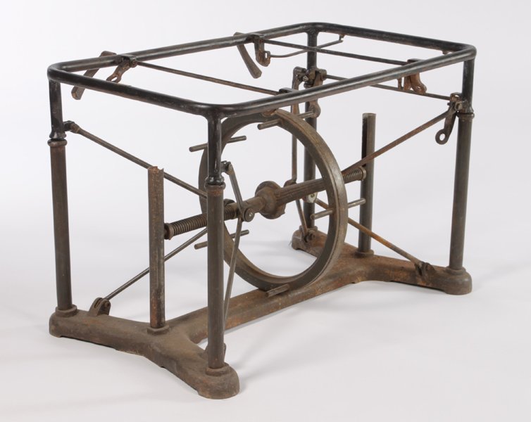 VINTAGE INDUSTRIAL METAL MECHANICAL TABLE C. 1920: A vintage industrial metal mechanical table with the base having central adjustable wheel circa 1920. Having remnants of a faint label. Ht: 29" Width: 35.5" Depth: 23"