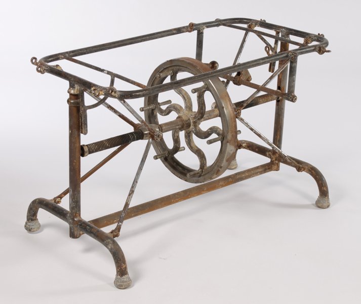 INDUSTRIAL METAL MECHANICAL TABLE BASE: A good industrial metal mechanical table base having multiple adjustments and central wheel circa 1910. Ht: 29" Width: 41" Depth: 21"