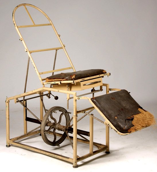ANTIQUE MECHANICAL METAL TABLE: Antique mechanical metal table having multiple adjustment for height and top circa 1920. Ht: 29" Width: 67" Depth: 20"