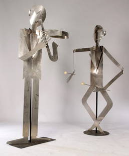 2 POLISHED CHROME FIGURES MUSICIANS SIGNED: Two polished chrome standing figures of musicians, signed "Hagenaver Wien, made in Austria" supported by iron post on base. Ht: 77" Width: 37" Depth: 20"