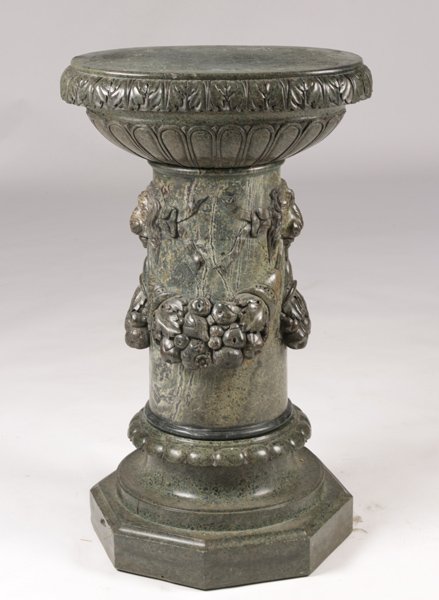 CARVED GREEN MARBLE PEDESTAL LION HEADS C 1880: A finely carved green marble pedestal having lion heads and swags of fruit as carved ornamentation circa 1880. Ht: 46" Width: 23" Depth: 16"