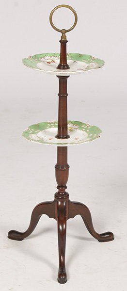 QUEEN ANNE STYLE PORCELAIN SERVING STAND: A Queen Anne style porcelain serving stand supported by central turned post and tripod base. Ht: 30" Width: 13" Depth: 13"