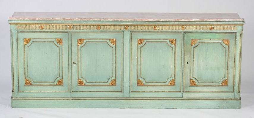 20TH C. CONTINENTAL INSPIRED GILT WOOD SIDEBOARD: Twentieth Century Continental inspired painted and gilt wood trimmed sideboard having shaped marble top over four raised paneled doors. Ht: 33" Width: 83" Depth: 19"
