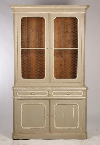FRENCH TWO PIECE BUFFET CIRCA 1890: A good painted French two piece buffet having an upper section with stepped cornice over two screen front doors over stepped out cabinet circa 1890. The stepped out cabinet with two paneled drawers an