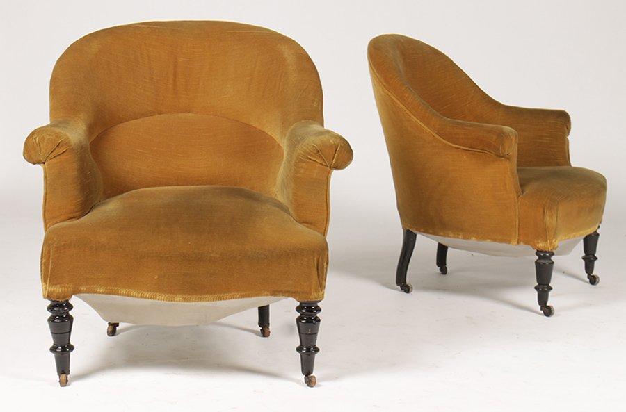 PR NAP III UPHOLSTERED BERGERE CHAIRS: A pair of Napoleon III upholstered bergere chairs having arched back and continuous arms raised on turned legs circa 1890. Ht: 31.5" Width: 30" Depth: 24"