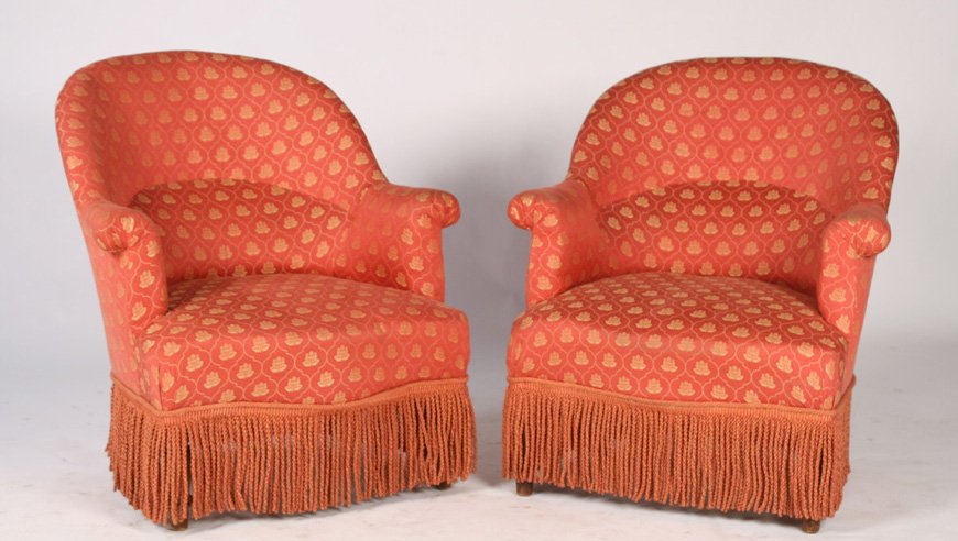 PAIR OF NAPOLEON III STYLE CHAIRS CIRCA 1940: A pair of Napoleon III style chairs having arched back and rolled arms raised on turned legs circa 1940. Ht: 33" Width: 29.5" Depth: 24"