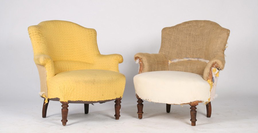 PAIR OF NAPOLEON III UPHOLSTERED CHAIRS C.1900: A pair of Napoleon III upholstered chairs having shaped back and rolled arms all raised on turned legs, circa 1900. Ht: 33" Width: 31" Depth: 21"