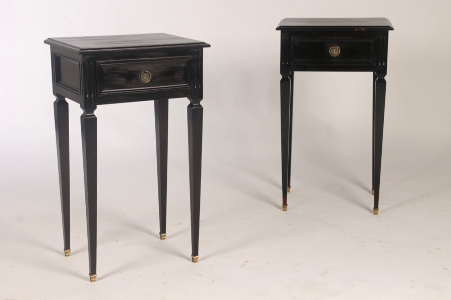 PAIR OF LOUIS SVI STYLE EBONIZED END TABLES: A pair of Louis XVI style ebonized end tables, each having a single drawer supported on tapered legs with bronze sabots, circa 1960. Ht: 27" Width: 16" Depth: 11.5"
