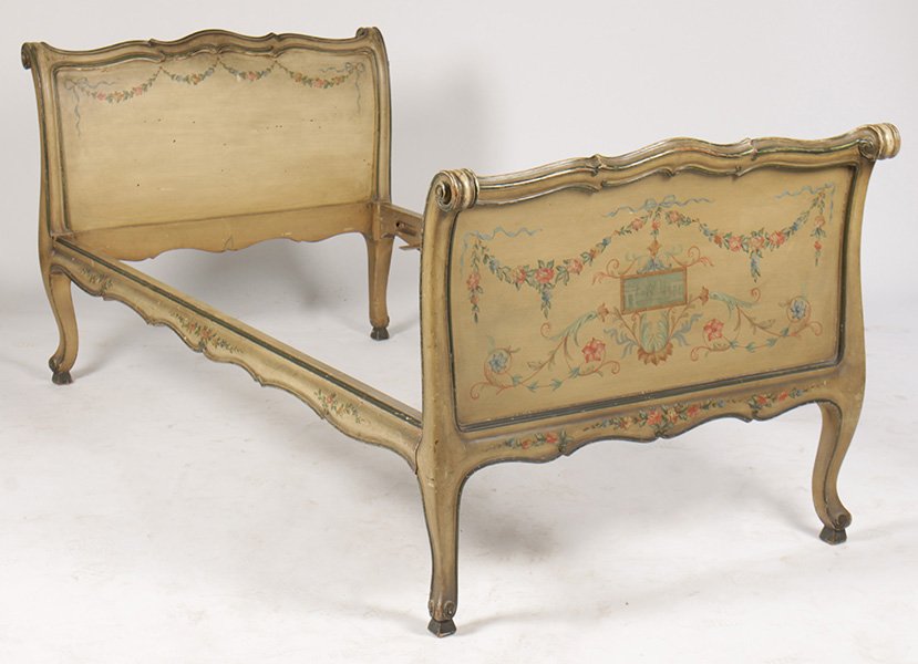 CONTINENTAL CARVED PAINTED DAYBED C 1910: A good continental carved and paint decorated daybed having neoclassical polychromed panels framed by floral garland circa 1910. No bolts. Ht: 36" Width: 76" Depth: 41"