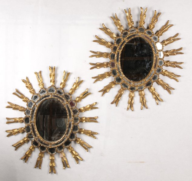 PAIR GILTWOOD GESSO SUNBURST MIRRORS: A pair of giltwood and gesso decorated sunburst mirrors. Ht: 23" Width: 22"