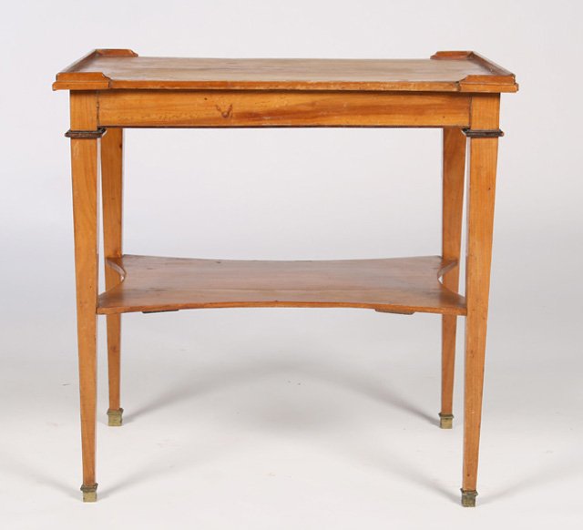 FRENCH DIRECTOIRE STYLE SIDE TABLE CIRCA 1940: A French Directoire style side table having shaped lower shelf supported on tapered legs, circa 1940. Ht: 24" Width: 23.5" Depth:17"