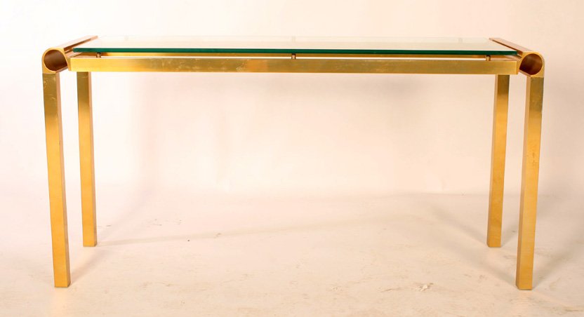 MODERN BRASS GLASS SOFA TABLE: A modern brass and glass sofa table circa 1980. Ht: 27.5" Width: 54" Depth: 16"