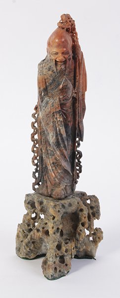 CHINESE CARVED SOAPSTONE ANCESTOR SCHOLAR STONE: A Chinese carved soapstone Ancestor raised on a scholar stone style base. Ht: 13.75" Width: 4" Depth: 3"