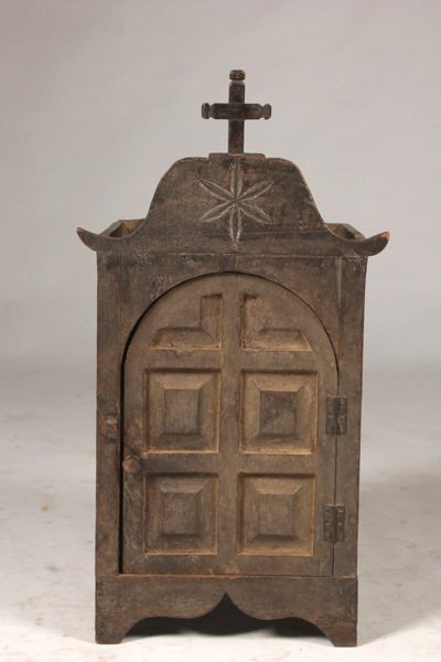 PORTUEGUESE CARVED ALTAR ARCH PANELED DOOR: Eighteenth Century and later Portuguese carved altar having shaped root with cross over arched paneled door. Ht: 28" Width: 15" Depth: 11"