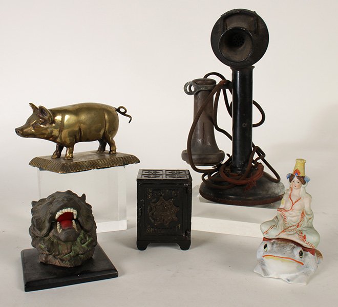 LOT OF 5 ECLECTIC PIECES LION INKWELL CIGAR: An eclectic early to mid twentieth century five piece lot. Consisting of an antique safe form bank, a Japanese ceramic frog princess incense burner, a neat brass pig cigar cutter, a lioness head form 