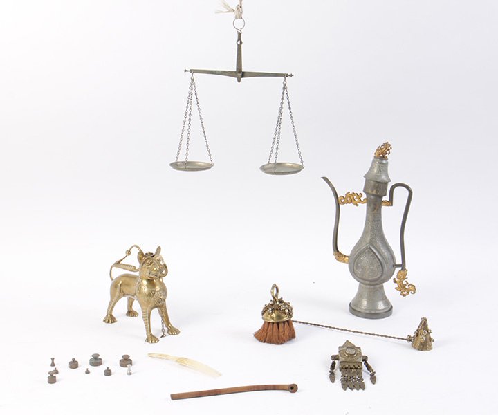 8 PC LOT MIXED MEDIA MIDDLE EASTERN/ASIAN ITEMS: Eight piece lot of early to mid twentieth Century mixed media Middle Eastern and Asian items. Consisting of a sweet lion form oil lamp, opium scale, match box, candle snuff and matching brush, bone ge