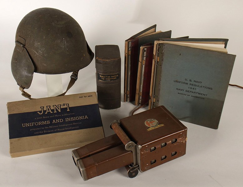 LOT OF 7 WWI WWII HELMET, STEREOCARDS, INSIGNIA +: Seven piece World War I and II era lot dating from 1918 to 1945. Consisting of an Army helmet with ear flaps, a slipcased set of stereocards "World War Through the Stereoscope," a Jan #1 boxed Army +