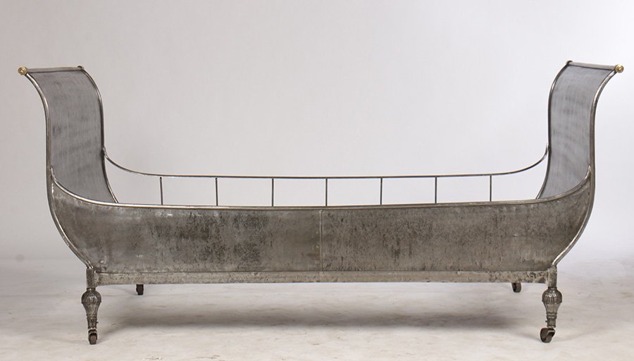 SOPHISTICATED STEEL IRON BRONZE DAYBED: A good and sophisticated Regency polished steel and bronze daybed having downswept ends resting on original casters.