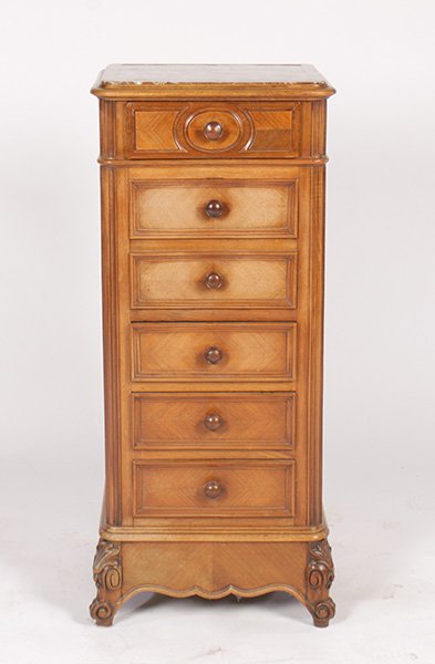 FRENCH MARBLE TOP NIGHTSTAND WALNUT CIRCA 1910: A French marble top walnut nightstand circa 1910. The case having four drawers and a fall front drawer housing a marble lined compartment. Ht: 38" Width: 16" Depth: 16"