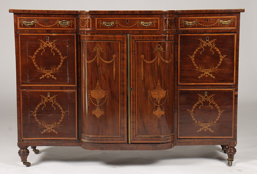 GOOD 19TH C. EDWARDIAN STYLE SIDEBOARD: A good nineteenth Century Edwardian style sideboard having banded shaped top with central urn and scrolling foliate inlay. Having three small drawers and two central doors having urn and draped garlan