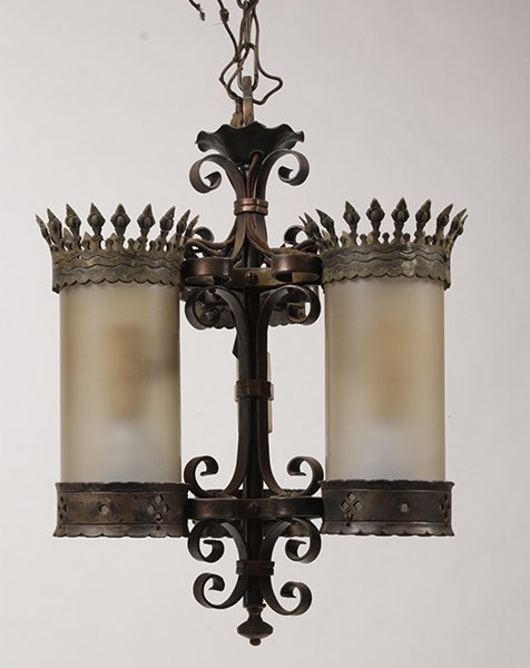 GOTHIC STYLE WROUGHT IRON LANTERN CIRCA 1900: A Gothic style wrought iron lantern having three crown decorated cylinder lights framing central scroll work circa 1900. Ht: 21" Width: 16" Depth: 16"