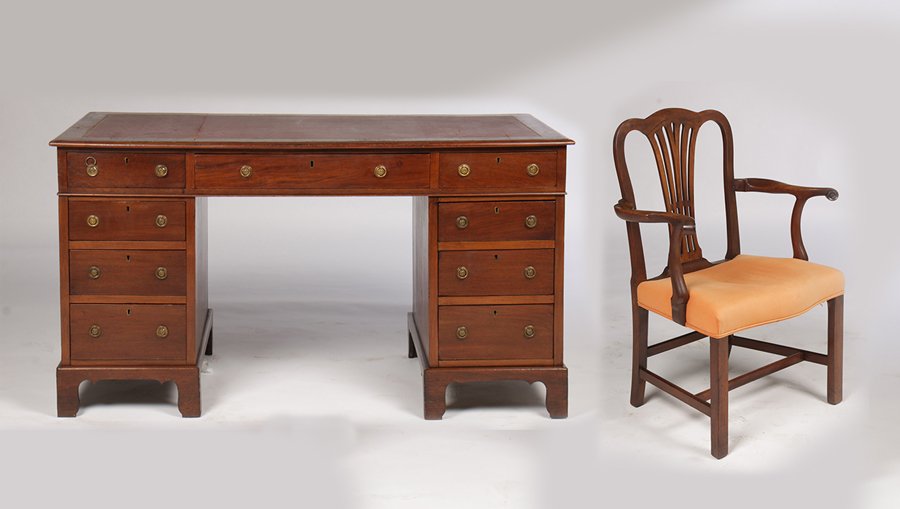 ENGLISH LEATHER TOP PARTNERS DESK & ARM CHAIR: An English leather top partners desk and Chippendale style arm chair circa 1910.