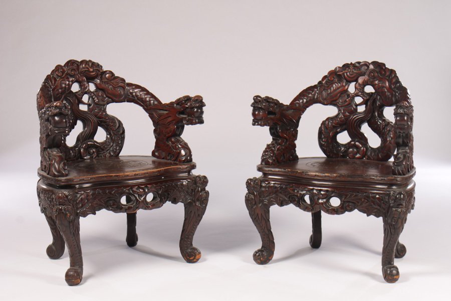 PR AISAN DRAGON CARVED ARM CHAIRS: A pair of Asian dragon carved arm chairs circa 1910.