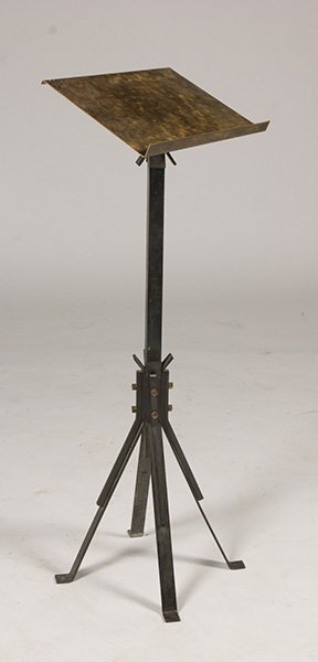 FRENCH MODERNIST IRON BRONZE BOOK STAND J.QUINET: An interesting French modernist iron and bronze book stand in the manner of Jacque Quinet. The splayed iron legs secured to the central post with bronze bolts, the whole supporting a bronze book tray.