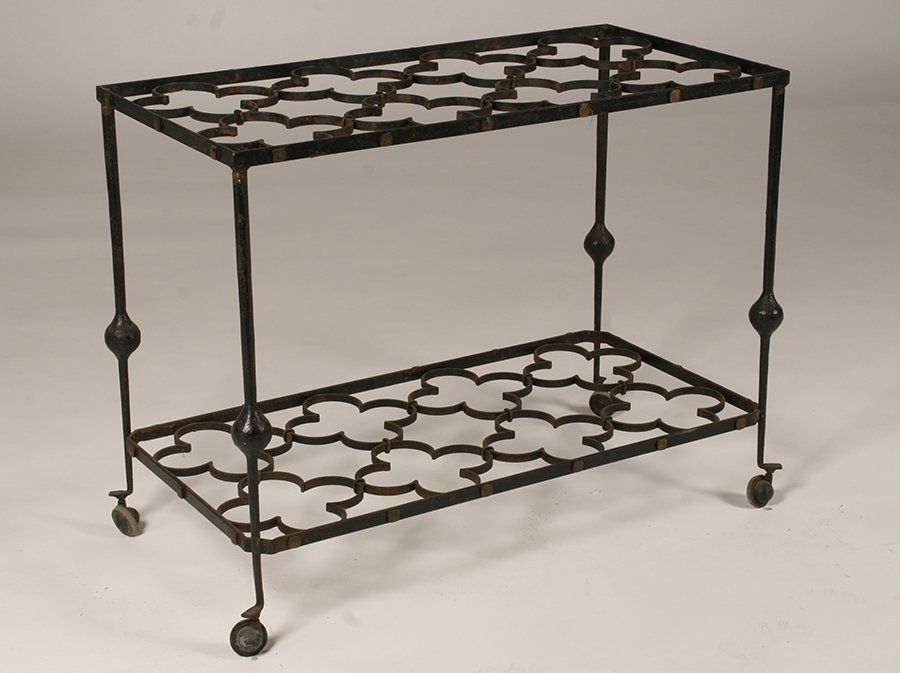 2 TIERED FRENCH WROUGHT IRON TEA CART C. 1945: An interesting French two tiered wrought iron tea cart with quatrefoil decoration raised on casters circa 1945. Ht: 27" Width: 34.5" Depth: 17.5"